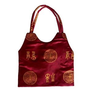 Red Satin bag with gold accents Vintage 1980’s. Inside very clean satin.